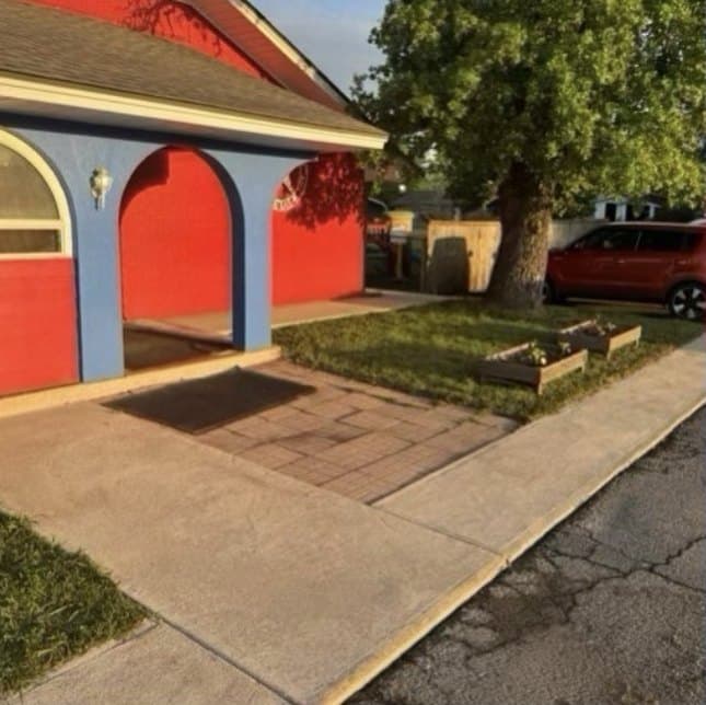 Commercial building entry, pavers and sidewalk before and after pressure washing by Ascension Exterior Services
