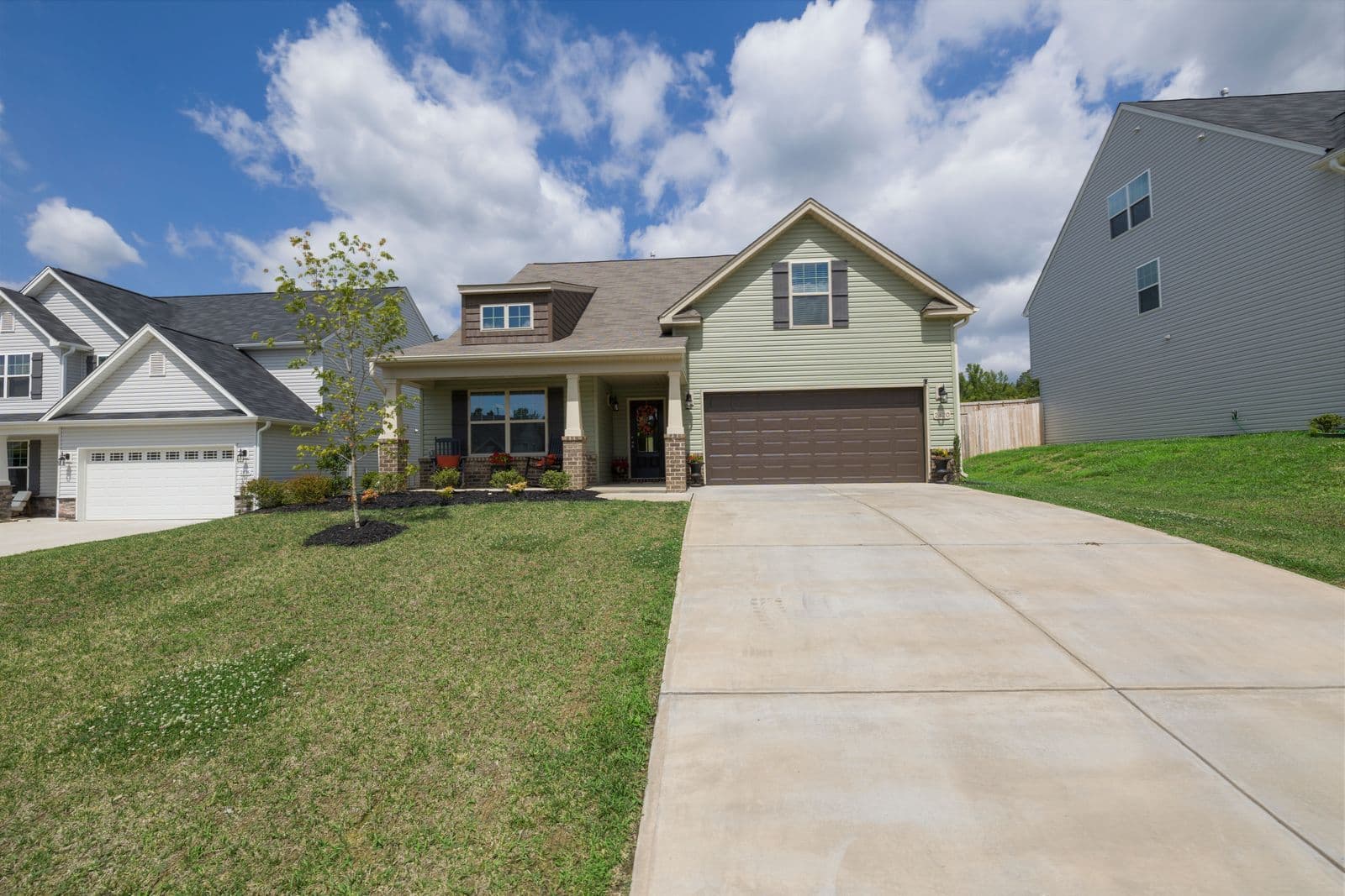 A suburban home with a wide concrete driveway, the most common job in town